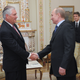 President-Elect and Russian Prime Minister Vladimir Putin (2-R) shakes hands with Exxon Mobile CEO and Chairman Rex Tillerson (L) during their meeting in Moscow, Russia, 16 April 2012.